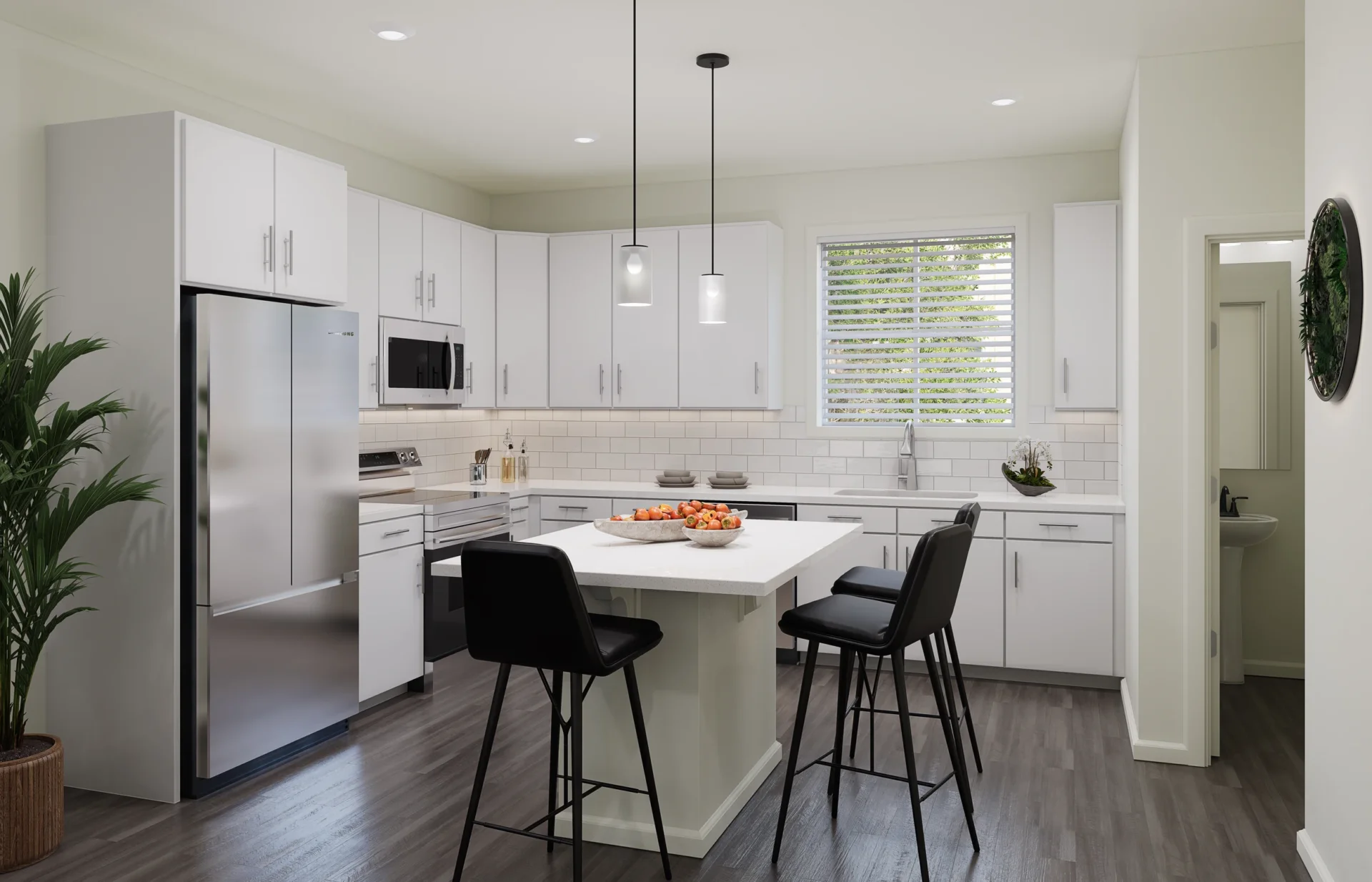 Modern kitchen with island, white cabinetry and stainless steel appliances at The Peaks at Canyons